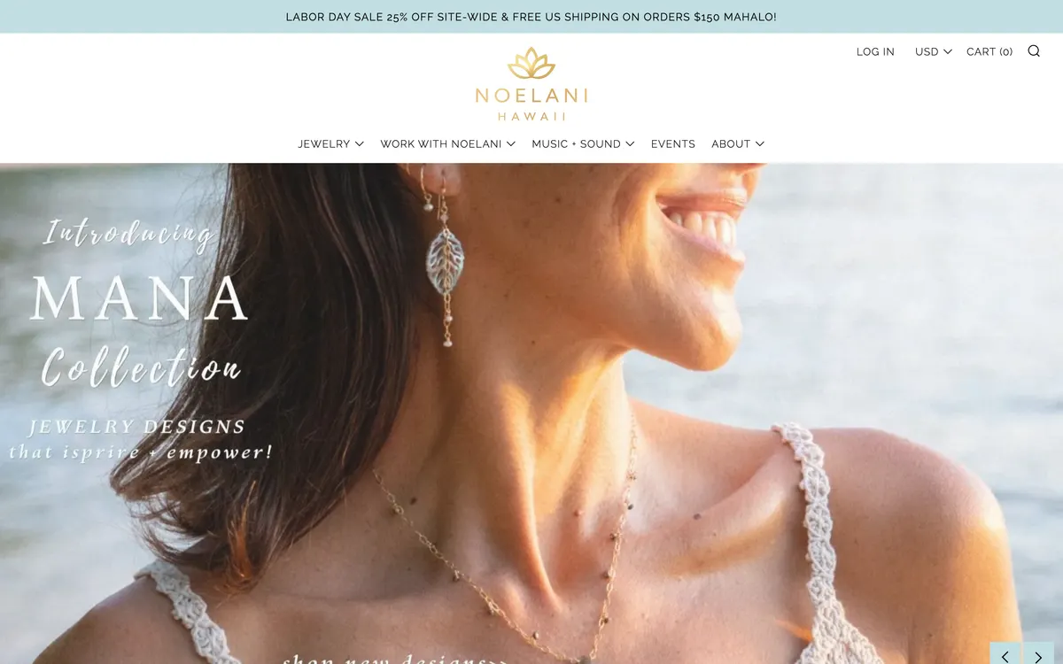 The Noelani Hawaii storefront on a desktop screen: an announcement bar carrying a Labor Day sale, a gold lotus wordmark, a navigation row reading Jewelry, Work with Noelani, Music and Sound, Events, About, and a hero photograph of a woman wearing gold earrings by the sea.